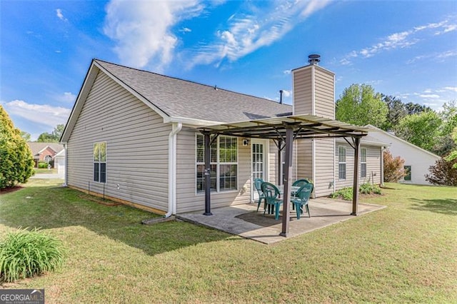 2602 Midler Ct, Buford, GA 30519 - rear view of house with a yard, a patio area, a chimney, and a shingled roof