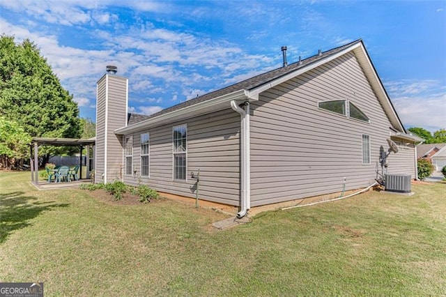 2602 Midler Ct, Buford, GA 30519 - view of home's exterior featuring a chimney, a yard, and a patio
