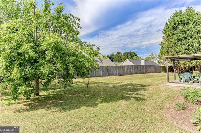 2602 Midler Ct, Buford, GA 30519 - fenced backyard featuring a patio