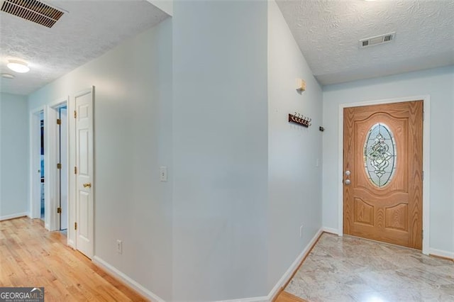 2602 Midler Ct, Buford, GA 30519 - entrance foyer featuring a textured ceiling and baseboards