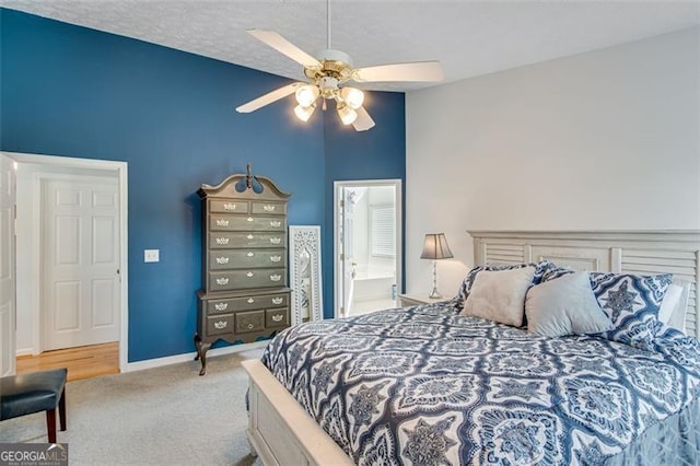 2602 Midler Ct, Buford, GA 30519 - carpeted bedroom with a ceiling fan, connected bathroom, and lofted ceiling