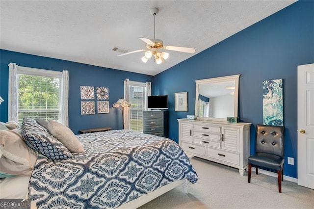 2602 Midler Ct, Buford, GA 30519 - bedroom featuring vaulted ceiling, carpet flooring, a ceiling fan, and a textured ceiling