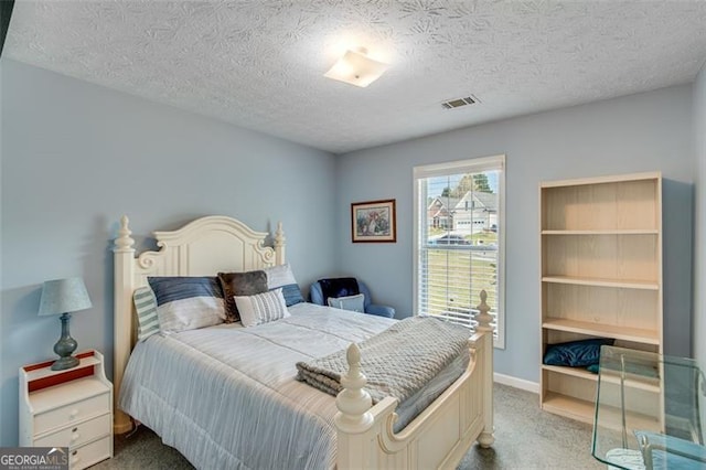 2602 Midler Ct, Buford, GA 30519 - carpeted bedroom featuring a textured ceiling and baseboards