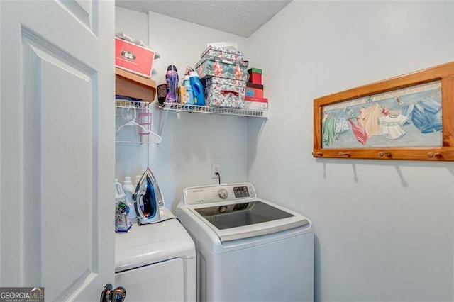 2602 Midler Ct, Buford, GA 30519 - laundry area with washer and clothes dryer and a textured ceiling