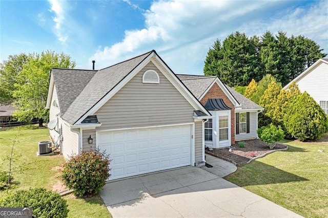 2602 Midler Ct, Buford, GA 30519 - view of front of home with concrete driveway, an attached garage, a front lawn, and a shingled roof