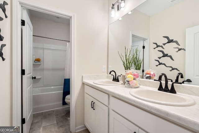 1027 Victoria Heights Dr, Dallas, GA 30132 - bathroom featuring double vanity and shower / bathtub combination with curtain
