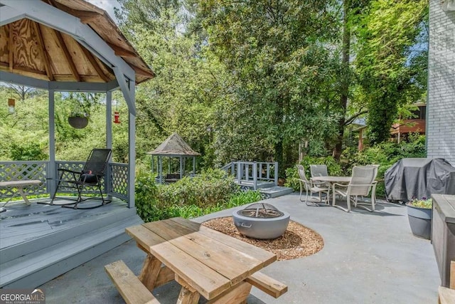 20 Mitchell Cir SE, Rome, GA 30161 - view of patio / terrace with a gazebo, outdoor dining area, a grill, an outdoor fire pit, and a deck