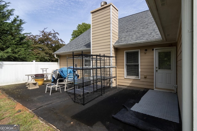 view of patio featuring fence