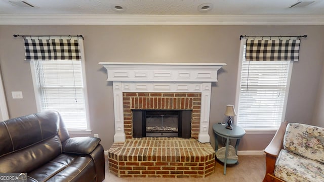 living room featuring baseboards, visible vents, ornamental molding, and carpet floors