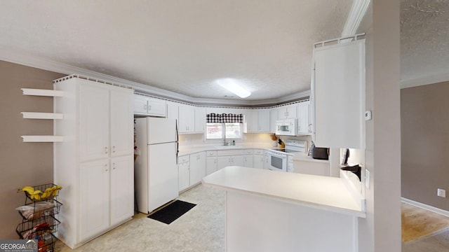 kitchen featuring a sink, open shelves, white cabinetry, a peninsula, and white appliances