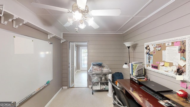 office with wood walls and a ceiling fan