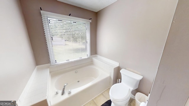 bathroom featuring toilet and a bath