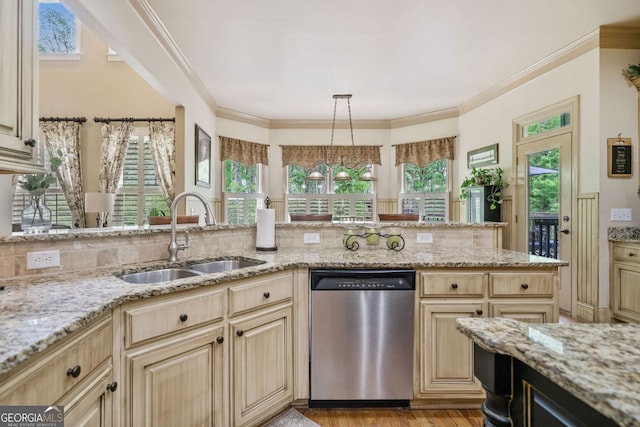 kitchen featuring light brown cabinetry, light stone countertops, light wood-type flooring, dishwasher, and a sink