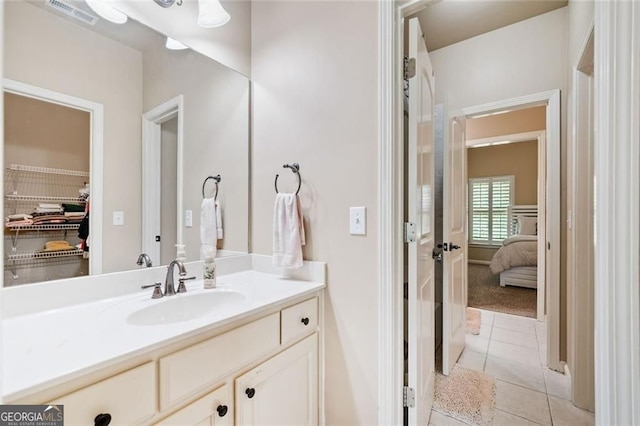 bathroom featuring tile patterned floors, visible vents, and vanity