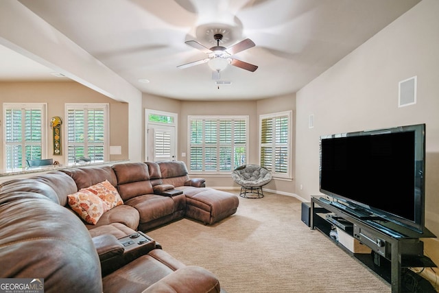 carpeted living area with visible vents, a ceiling fan, and baseboards
