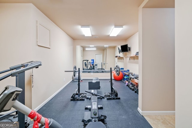 exercise area with baseboards