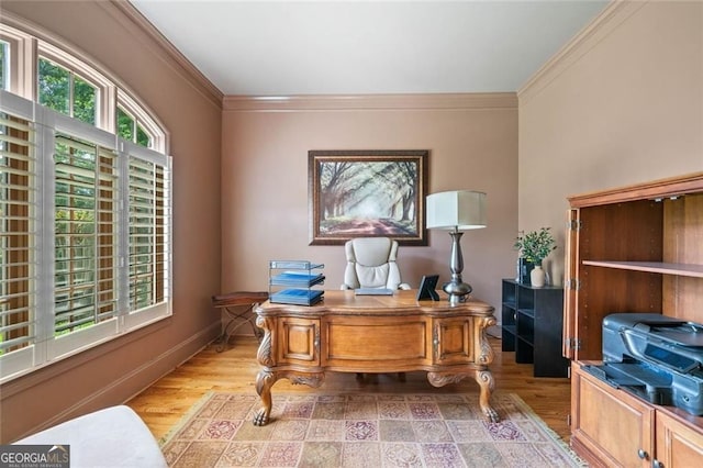 home office featuring crown molding and light wood-style flooring