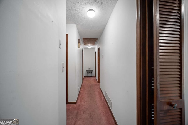 110 Otelia Ln, Covington, GA 30014 - corridor featuring a textured ceiling, visible vents, carpet floors, and baseboards
