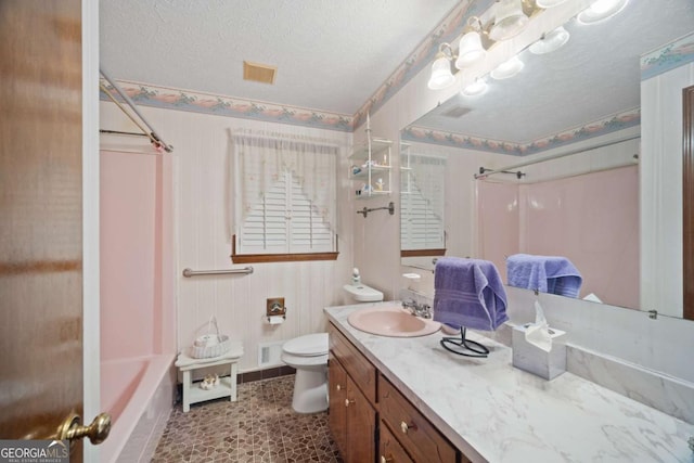 110 Otelia Ln, Covington, GA 30014 - bathroom featuring a textured ceiling, visible vents, baseboards, toilet, and vanity
