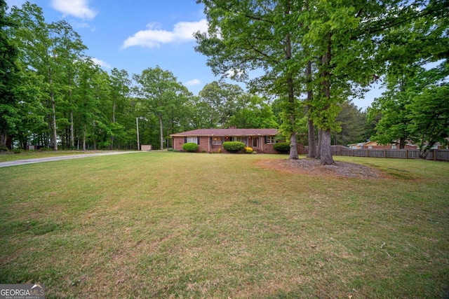 110 Otelia Ln, Covington, GA 30014 - view of front of property featuring fence and a front lawn
