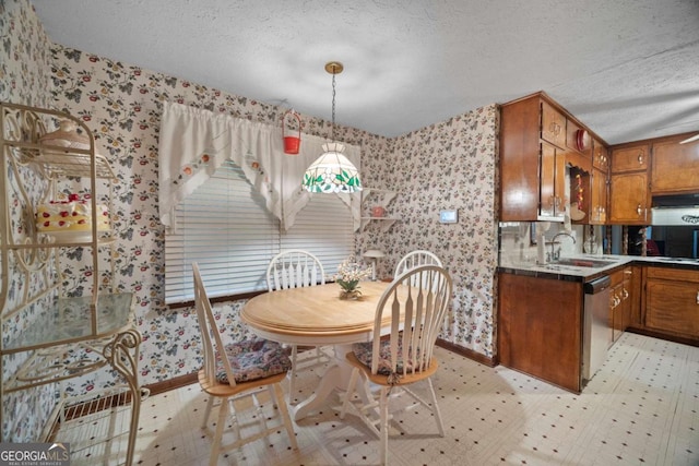 110 Otelia Ln, Covington, GA 30014 - dining space featuring a textured ceiling, visible vents, wallpapered walls, baseboards, and light floors