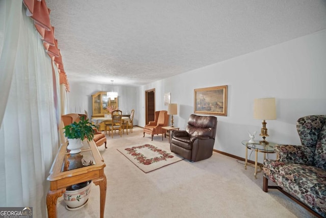 110 Otelia Ln, Covington, GA 30014 - carpeted living room with a chandelier and a textured ceiling