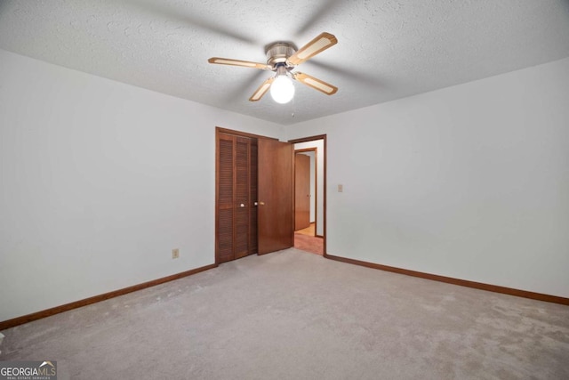 110 Otelia Ln, Covington, GA 30014 - unfurnished bedroom featuring carpet, a textured ceiling, and a closet