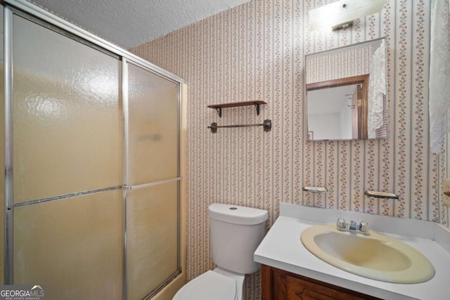 110 Otelia Ln, Covington, GA 30014 - full bath featuring vanity, toilet, an enclosed shower, a textured ceiling, and wallpapered walls
