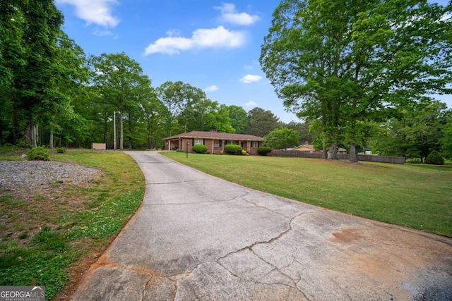 110 Otelia Ln, Covington, GA 30014 - view of front of house featuring driveway and a front lawn