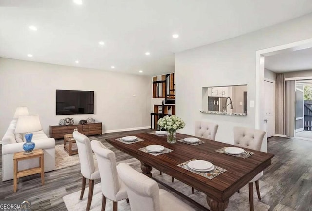 dining area featuring recessed lighting, wood finished floors, and baseboards