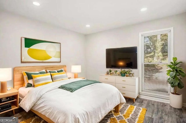 bedroom with wood finished floors and recessed lighting