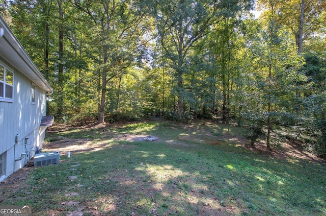 view of yard featuring a view of trees
