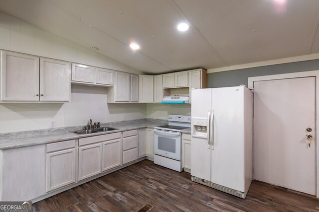 kitchen with white appliances, under cabinet range hood, dark wood finished floors, and a sink