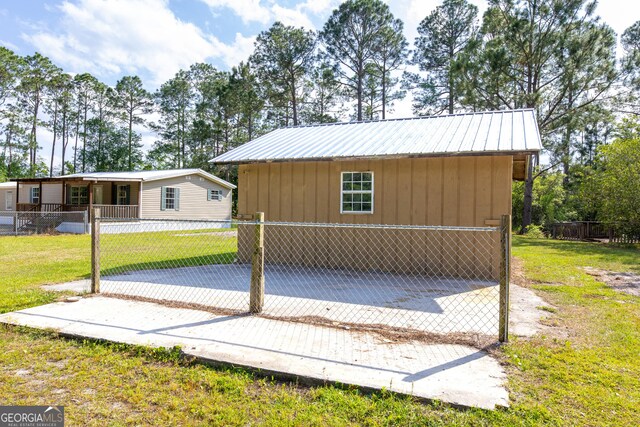 view of outdoor structure with fence