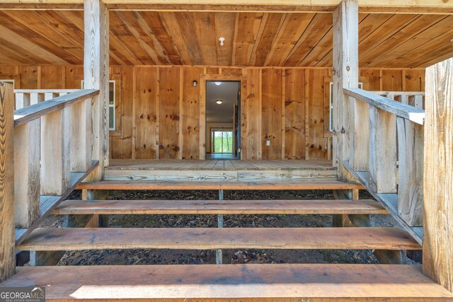 78 Lakota Trl, Royston, GA 30662 - staircase with wood ceiling and wooden walls