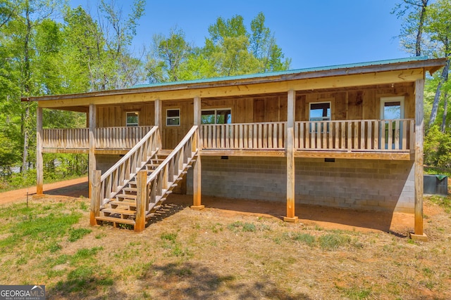 78 Lakota Trl, Royston, GA 30662 - back of house featuring crawl space and stairway