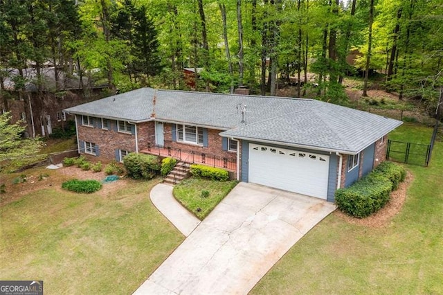 2558 Landeau Cir, Tucker, GA 30084 - ranch-style home with concrete driveway, a front lawn, an attached garage, and fence