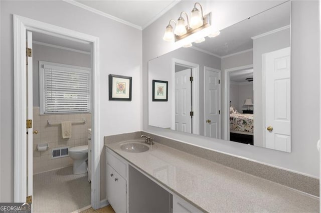 2558 Landeau Cir, Tucker, GA 30084 - ensuite bathroom with connected bathroom, visible vents, toilet, ornamental molding, and vanity