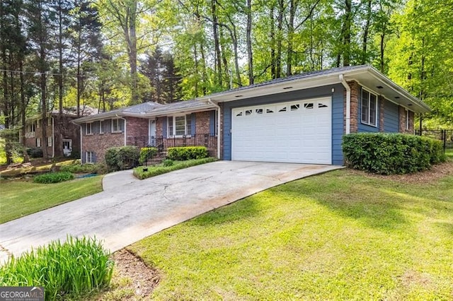 2558 Landeau Cir, Tucker, GA 30084 - ranch-style house featuring driveway, brick siding, a front yard, and an attached garage