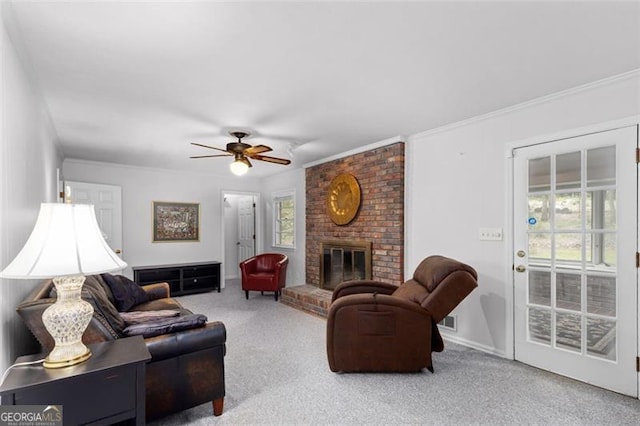 2558 Landeau Cir, Tucker, GA 30084 - carpeted living area featuring ornamental molding, a ceiling fan, visible vents, and a fireplace