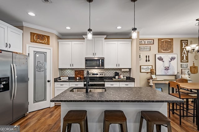 241 Simmons Dr Unit 6B, Ellijay, GA 30536 - kitchen featuring a sink, stainless steel appliances, tasteful backsplash, white cabinetry, and ornamental molding