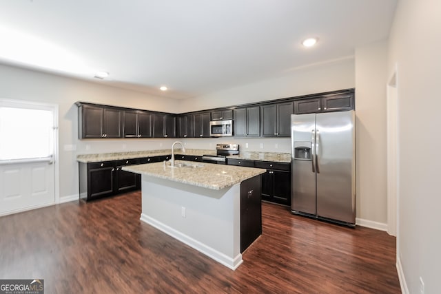 89 Citadel Dr, Hampton, GA 30228 - kitchen featuring dark wood-style floors, baseboards, stainless steel appliances, and a sink
