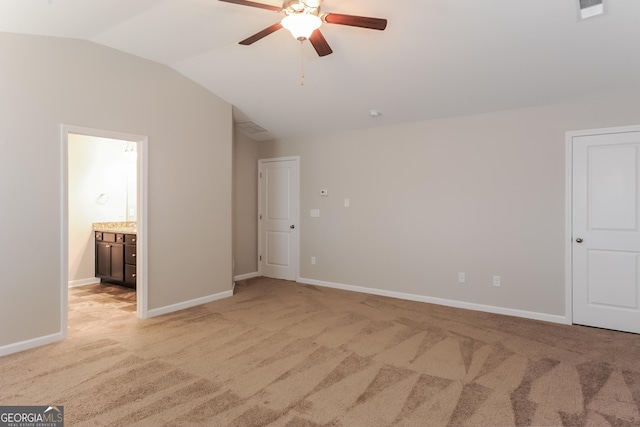 89 Citadel Dr, Hampton, GA 30228 - empty room featuring ceiling fan, visible vents, baseboards, vaulted ceiling, and light carpet