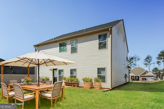 89 Citadel Dr, Hampton, GA 30228 - back of property with outdoor dining space and a yard