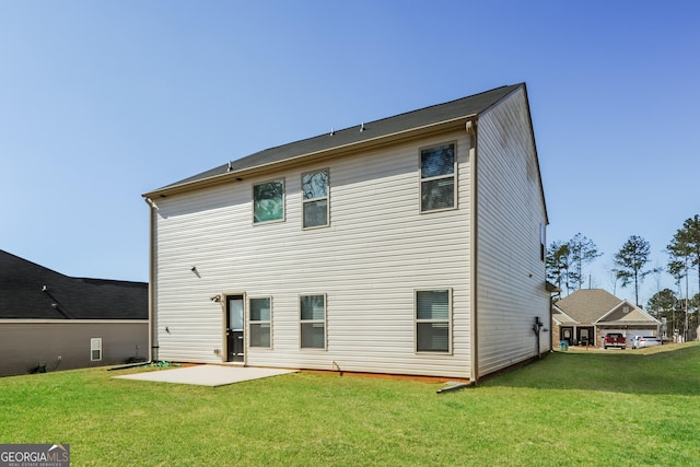 89 Citadel Dr, Hampton, GA 30228 - back of property featuring a lawn and a patio area