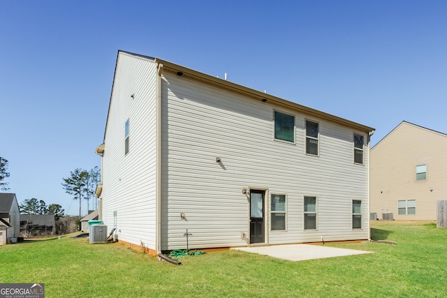 89 Citadel Dr, Hampton, GA 30228 - back of property with central AC, a patio, and a yard