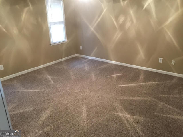 3875 Grand Prix St, Cumming, GA 30041 - unfurnished room featuring baseboards and dark carpet