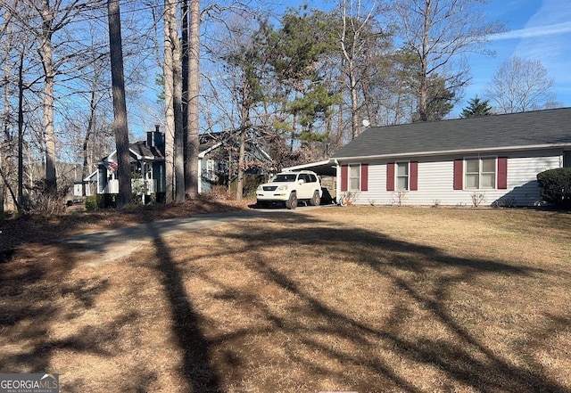 3875 Grand Prix St, Cumming, GA 30041 - view of outdoor structure featuring fence and an attached carport
