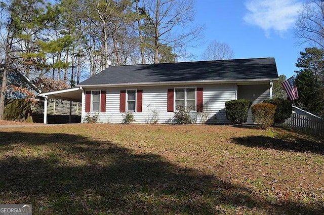 3875 Grand Prix St, Cumming, GA 30041 - exterior space with an attached carport and fence