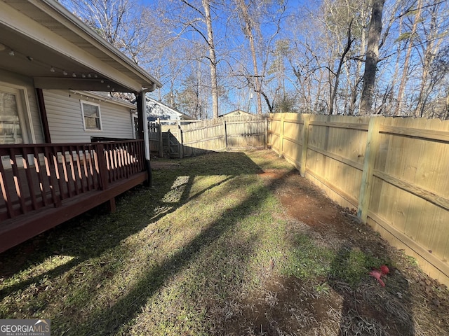 3875 Grand Prix St, Cumming, GA 30041 - view of yard featuring a wooden deck and a fenced backyard